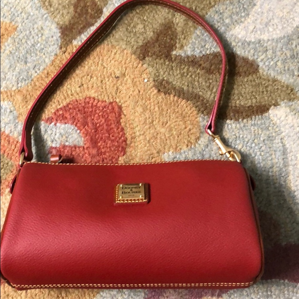 Authentic Dooney & Bourne barrel bag in red.